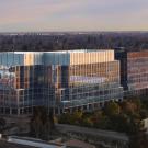 A large building in Sacramento on the UC Davis campus with many glass windows called Aggie Square